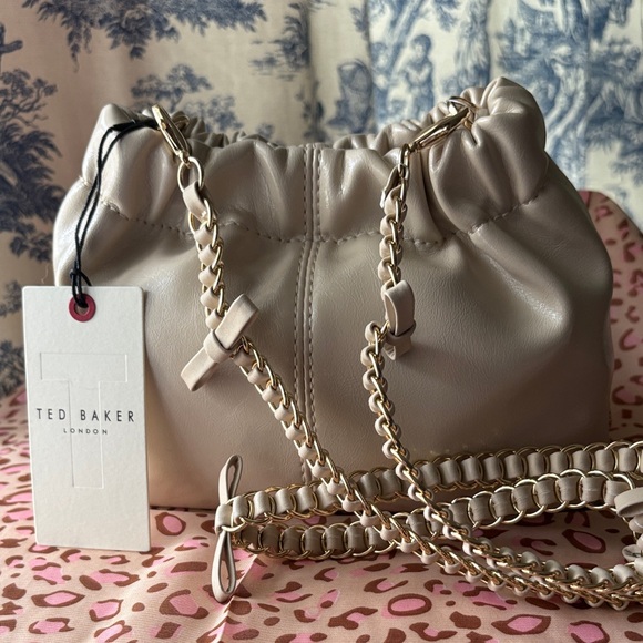 Ted Baker Handbags - Ted Baker Cream Drawstring Crossbody with Gold Chain